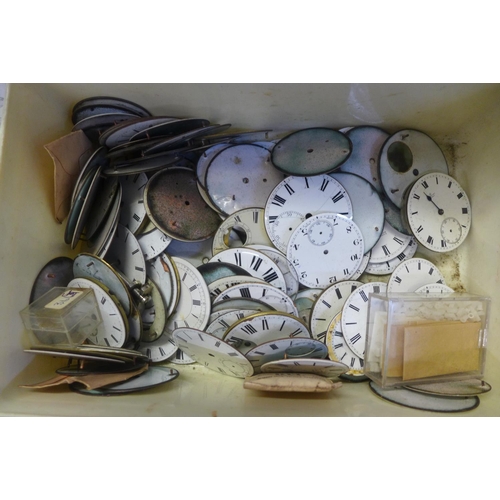 743 - A tub of enamel pocket watch dials