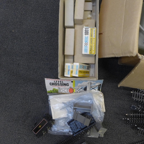 762 - A collection of model rail track, engines (11 motors), display track kits, a power control unit, etc... 