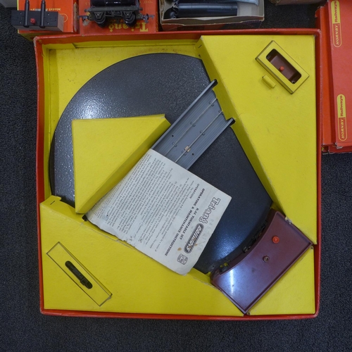 767 - A collection of Tri-ang model railway including wagons, railway, a Mail Coach set, Station set, turn... 