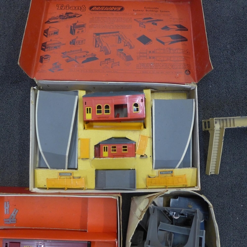 767 - A collection of Tri-ang model railway including wagons, railway, a Mail Coach set, Station set, turn... 