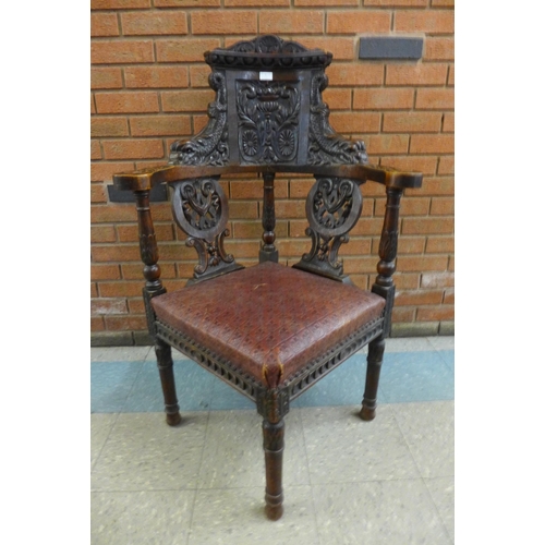 1 - A Victorian Jacobean Revival carved oak corner chair