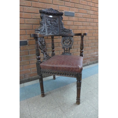 1 - A Victorian Jacobean Revival carved oak corner chair