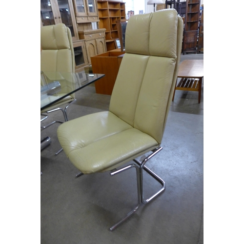 100a - An Italian chrome and glass topped dining table and  six Pieff chrome and cream leather chairs