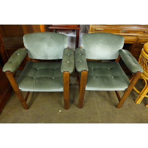 100b - A pair of Swedish Ulferts beech and green fabric upholstered elbow chairs