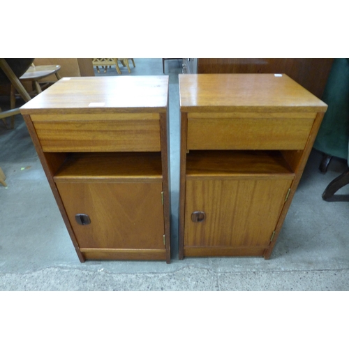 104 - A pair of teak bedside cabinets