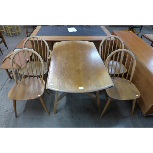 106 - An Ercol Blonde elm and beech drop-leaf table and four chairs