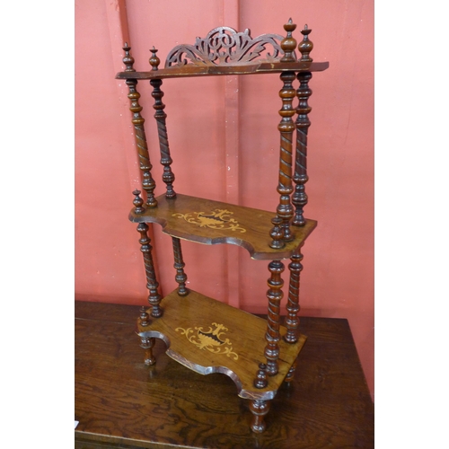 11 - A Victorian inlaid walnut three tier whatnot