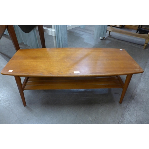 112 - A teak coffee table