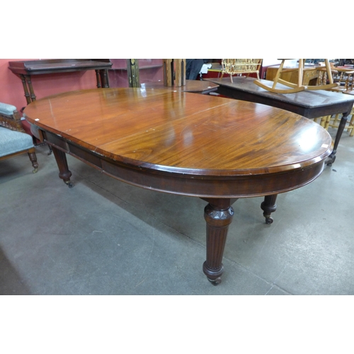 124 - A Victorian mahogany extending dining table