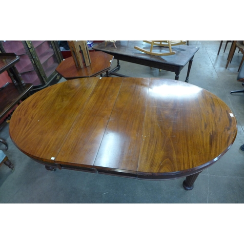 124 - A Victorian mahogany extending dining table