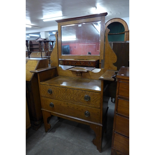 126 - An Arts and Crafts oak dressing table