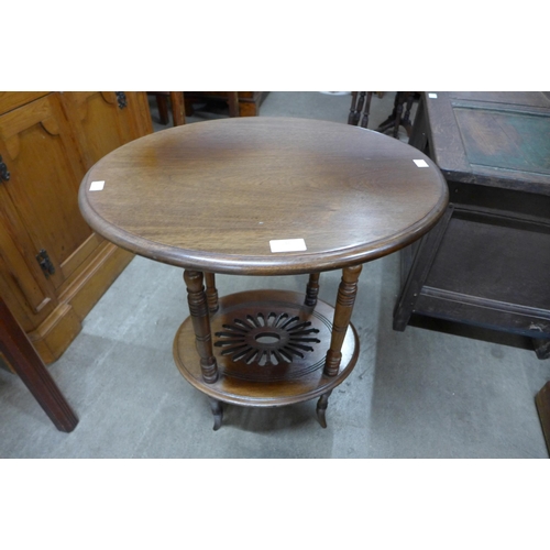 146 - An Arts and Crafts mahogany two tier occasional table