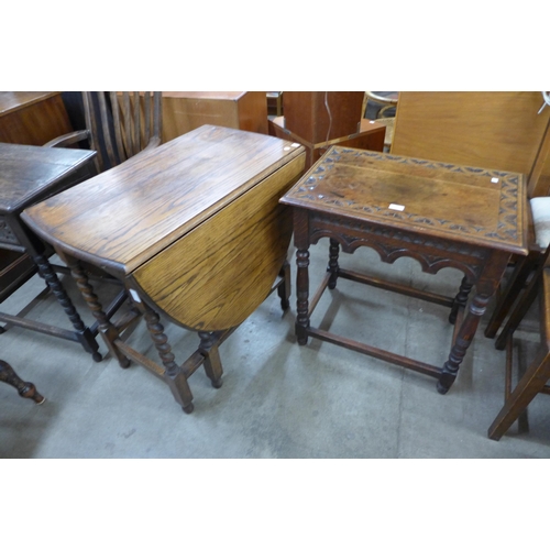 147 - An oak barleytwist gateleg table and a carved oak occasional table