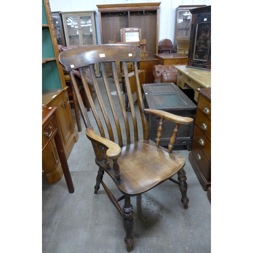 148 - A Victorian beech farmhouse armchair