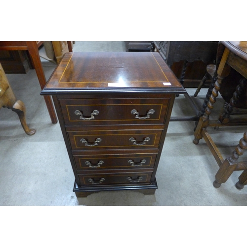 149 - A small inlaid mahogany chest of drawers