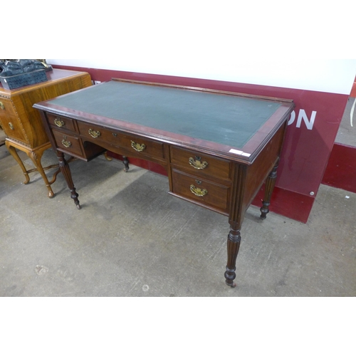 15 - A late Victorian Shapland & Petter of Barnstable mahogany and green leather topped writing table