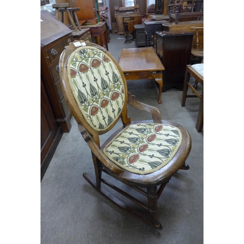 151 - A late Victorian beech rocking chair