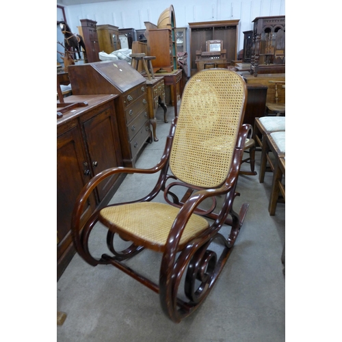 152 - A beech bentwood and rattan rocking chair