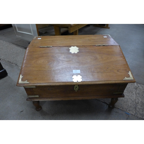 155 - A small eastern hardwood and brass mounted box in stand