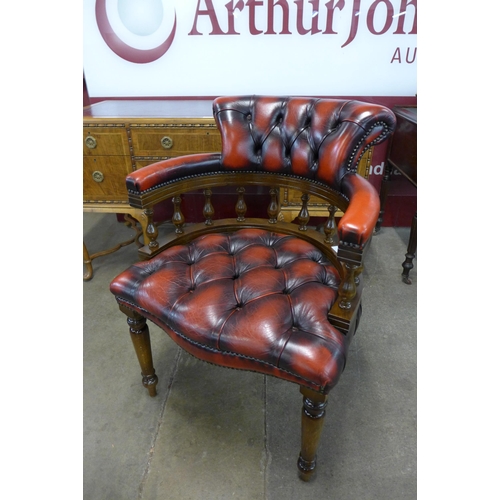 18 - A beech and ox blood leather desk chair