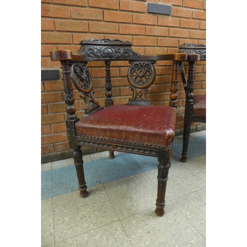 2 - A pair of Victorian Jacobean Revival carved oak corner chairs