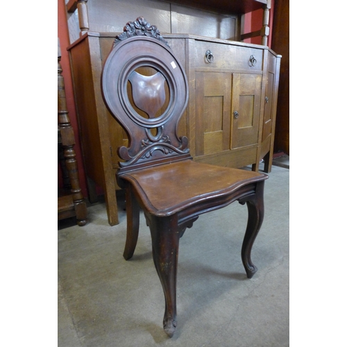 22 - A pair of Victorian mahogany hall chairs