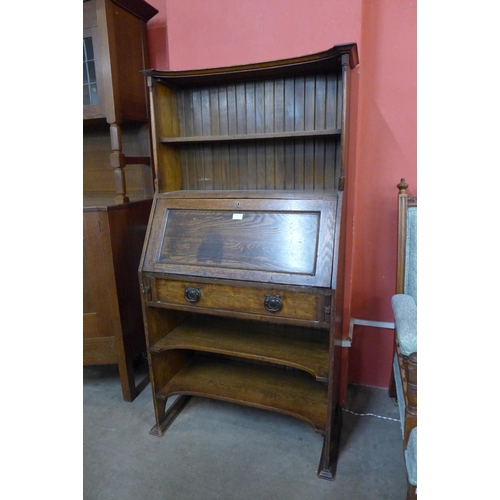 24 - An Arts and Crafts oak bureau bookcase