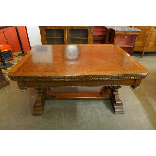 29 - A 17th Century style carved oak draw-leaf table, 78cms h, 137cms l, 99cms w