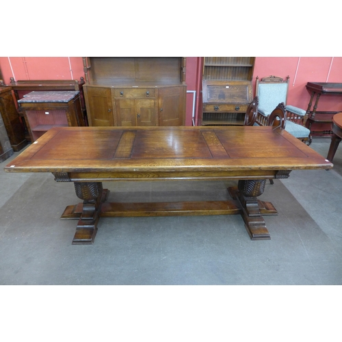 30 - An Elizabethan Revival carved oak refectory table, 77cms h, 240cms l, 91cms w