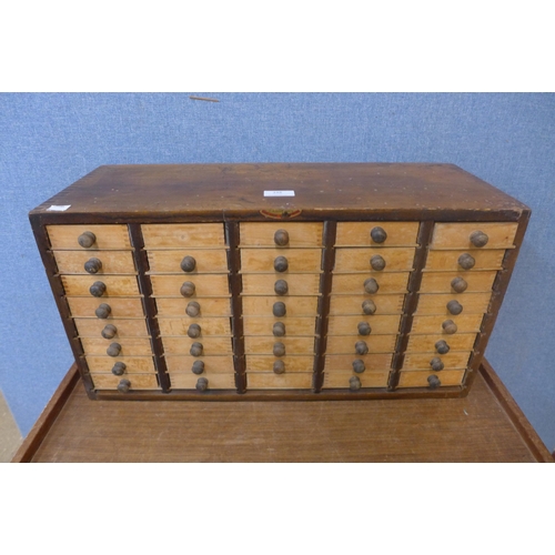 348 - A vintage beech table top chest