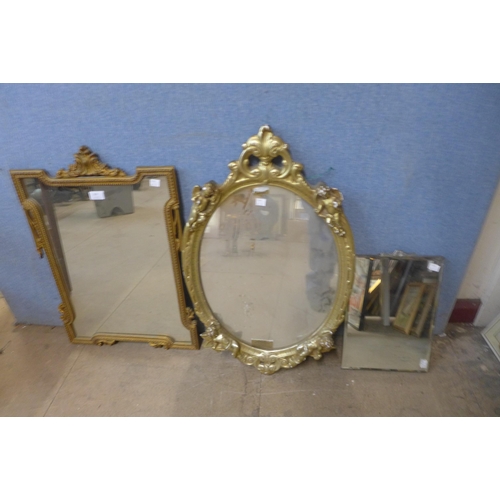 357 - Two gilt framed mirrors and three others