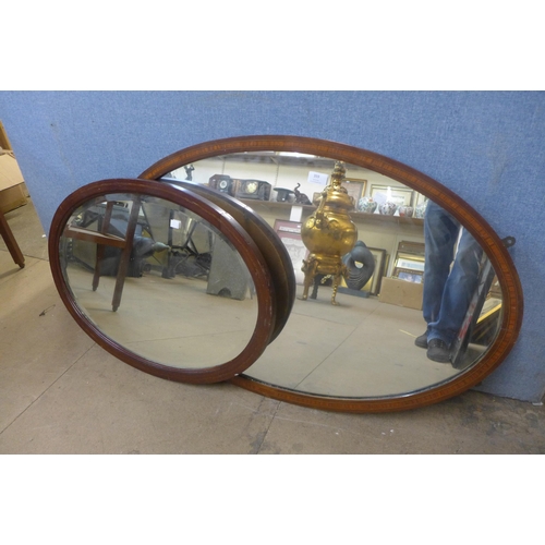 359 - Two Edward VII inlaid mahogany framed oval mirrors