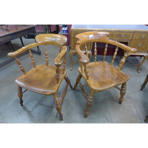 36 - A pair of similar Victorian elm and beech smokers bow chairs