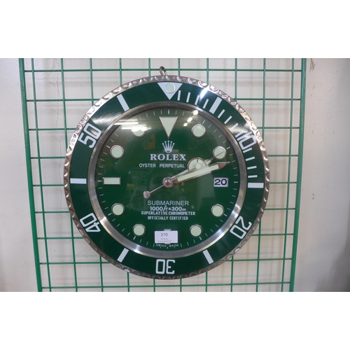 370 - A Rolex style dealer's circular wall clock