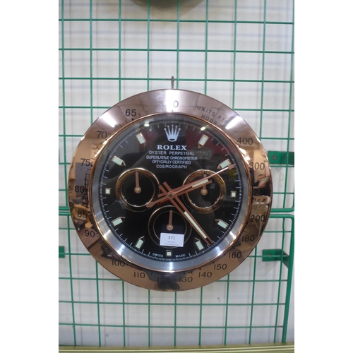 371 - A Rolex style dealer's circular wall clock