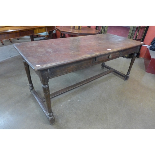 38 - A 17th Century oak single drawer refectory table