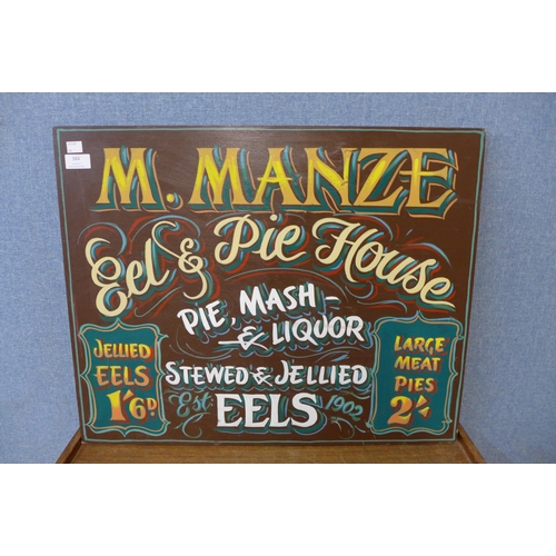 384 - A painted wooden sign, M. Manze, Ale & Pie House