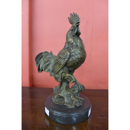 400 - A bronze figure of a cockerel, on black marble socle