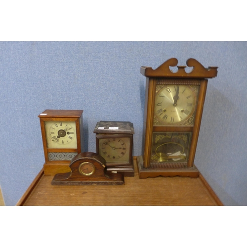 410 - Three assorted mantel clocks and a wall clock