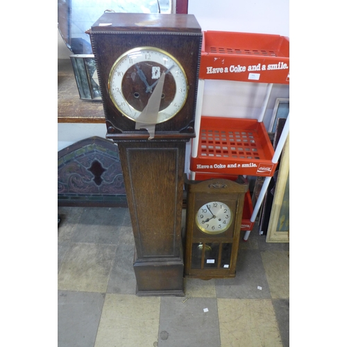 414 - An oak dwarf longcase clock and an oak wall clock