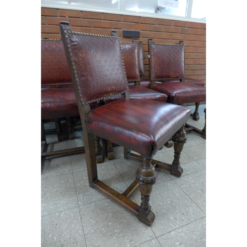 5 - A set of eight 17th Century style carved oak and red leather chairs