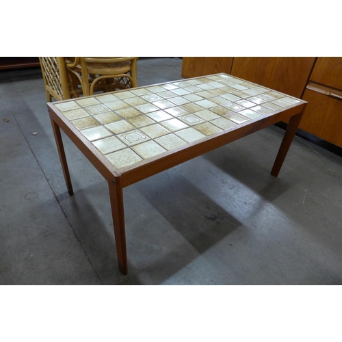 55 - A Danish teak and tiled top coffee table