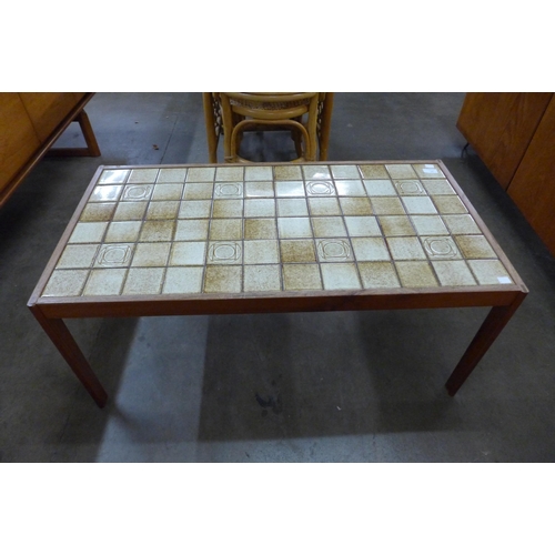 55 - A Danish teak and tiled top coffee table