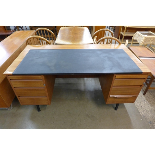 59 - A teak and black vinyl topped desk and chair