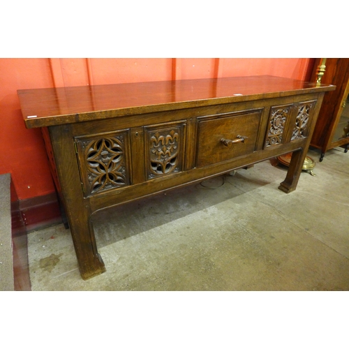 6 - An Elizabethan Revival carved oak dresser