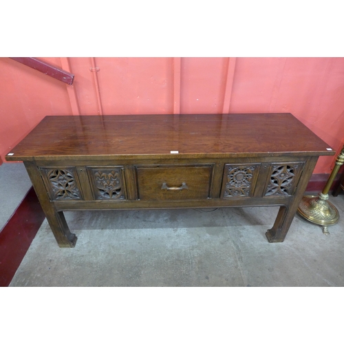 6 - An Elizabethan Revival carved oak dresser