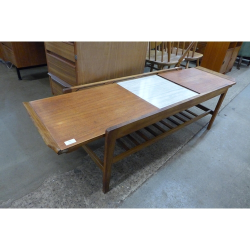 61 - A Remploy teak extending coffee table