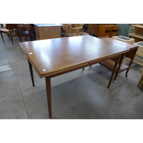 62 - A Danish teak extending dining table