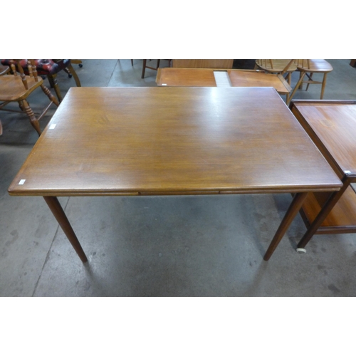 62 - A Danish teak extending dining table