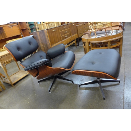 65 - A Charles & Ray Eames style simulated rosewood, chrome and faux black leather revolving lounge chair... 